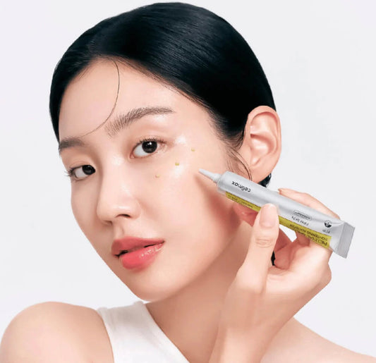 Applying the Celimax Tightening Booster serum for deep absorption and firming