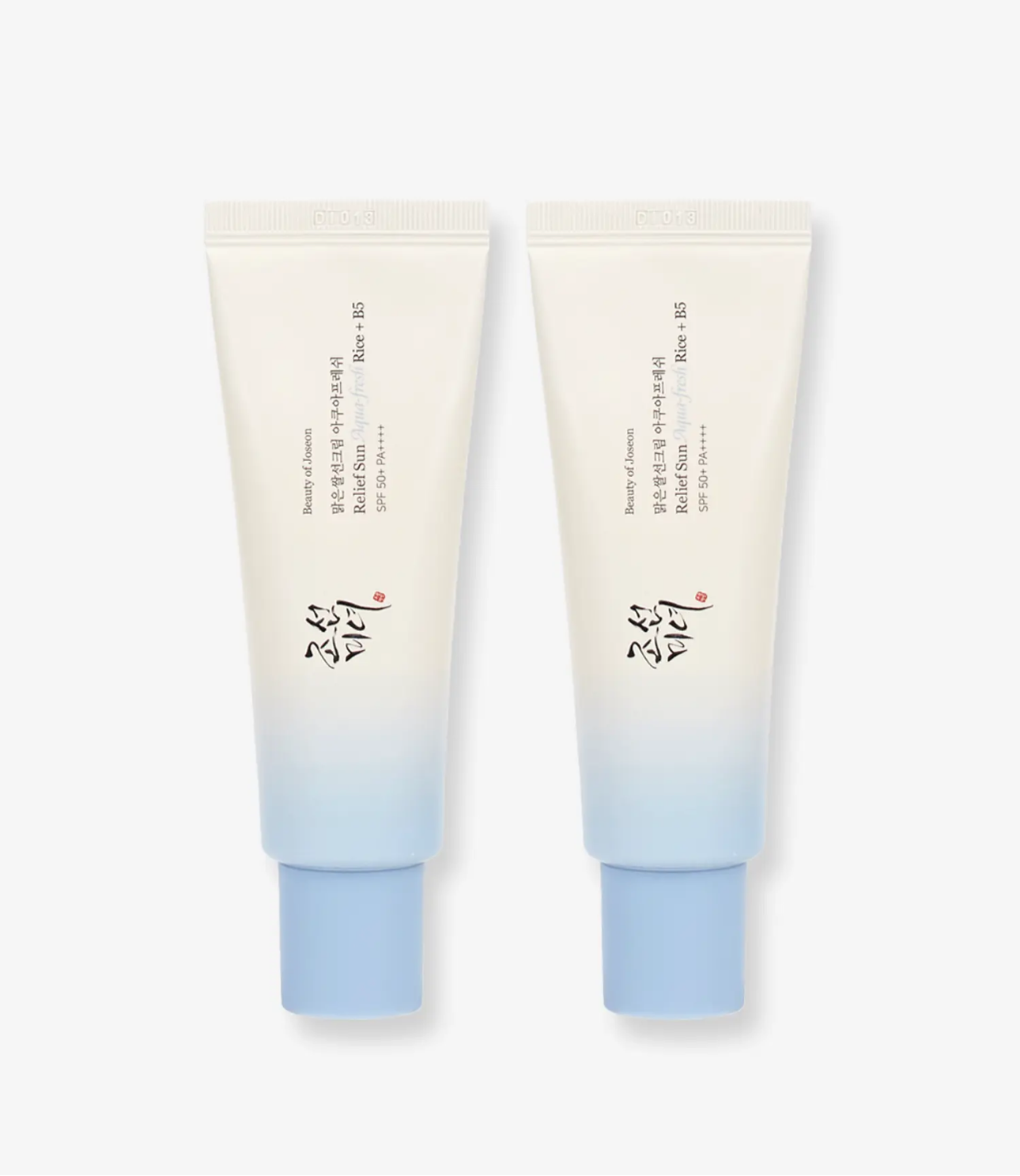 Two tubes of cream with a gradient from beige to blue on a white background Two tubes of cream with a gradient from beige to blue on a white background