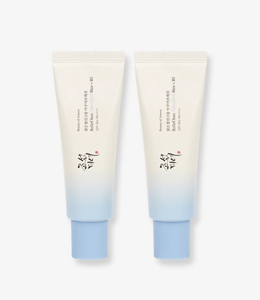 Two tubes of cream with a gradient from beige to blue on a white background