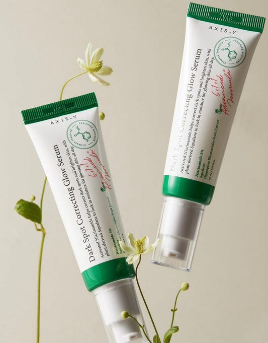 Axis-Y Dark Spot Correcting Glow Serum bottle, showcasing its sleek, minimalist design.