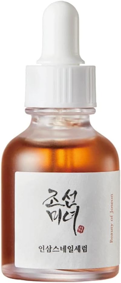 Dropper releasing Revive Serum — ginseng and snail mucin lightweight texture