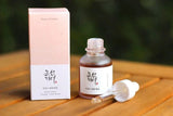 Beauty of Joseon Revive Serum (ginseng + snail mucin) bottle with box on a wooden surface Beauty of Joseon Revive Serum (ginseng + snail mucin) bottle with box on a wooden surface