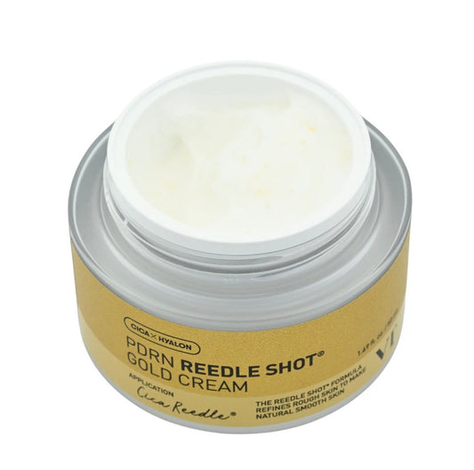 A pea-sized amount of the PDRN Reedle Shot Gold Cream on skin, showing the rich golden cream texture