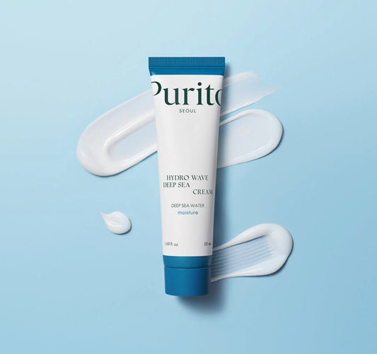 A close-up swatch of the Hydro Wave Deep Sea Cream, highlighting its soft, velvety texture that melts into the skin.