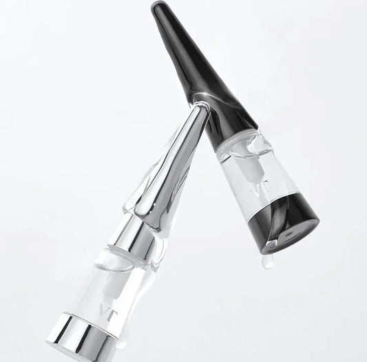 A close-up of the Reedle Shot Lip Plumper Expert applicator and sleek bottle design.