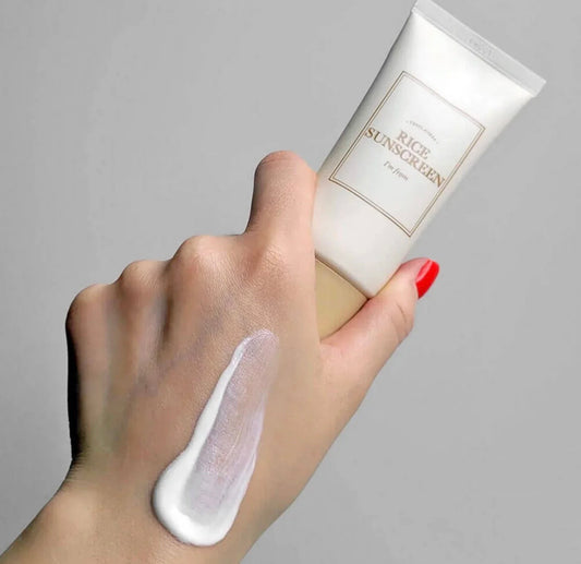 Creamy texture of rice sunscreen SPF 50 PA absorbing smoothly on skin