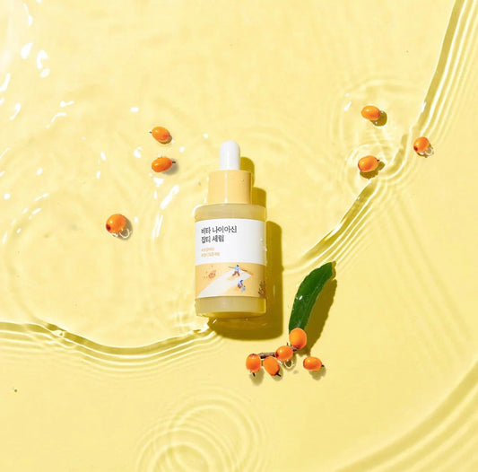 A person enjoying the soothing, non-sticky feel of the Round Lab Vita Niacinamide Serum.