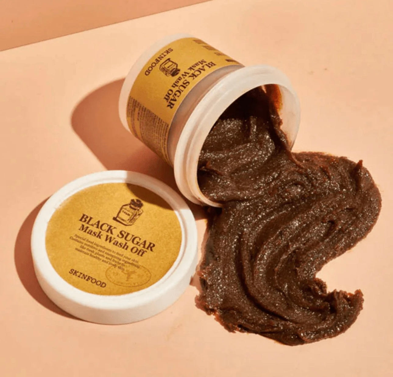 Close-up of the Skinfood Sugar Mask's rich, grainy texture with black sugar crystals. Close-up of the Skinfood Sugar Mask's rich, grainy texture with black sugar crystals.