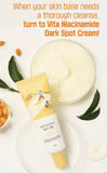 Applying the Vita Niacinamide dark spot cream to the cheek