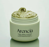 Close-up of the ARENCIA Mochi Cleanser's texture and green rice particles.