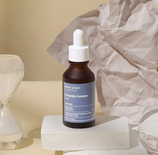 Mary & May 6 Peptide Complex Serum bottle, 30ml, showcasing its elegant dropper design.