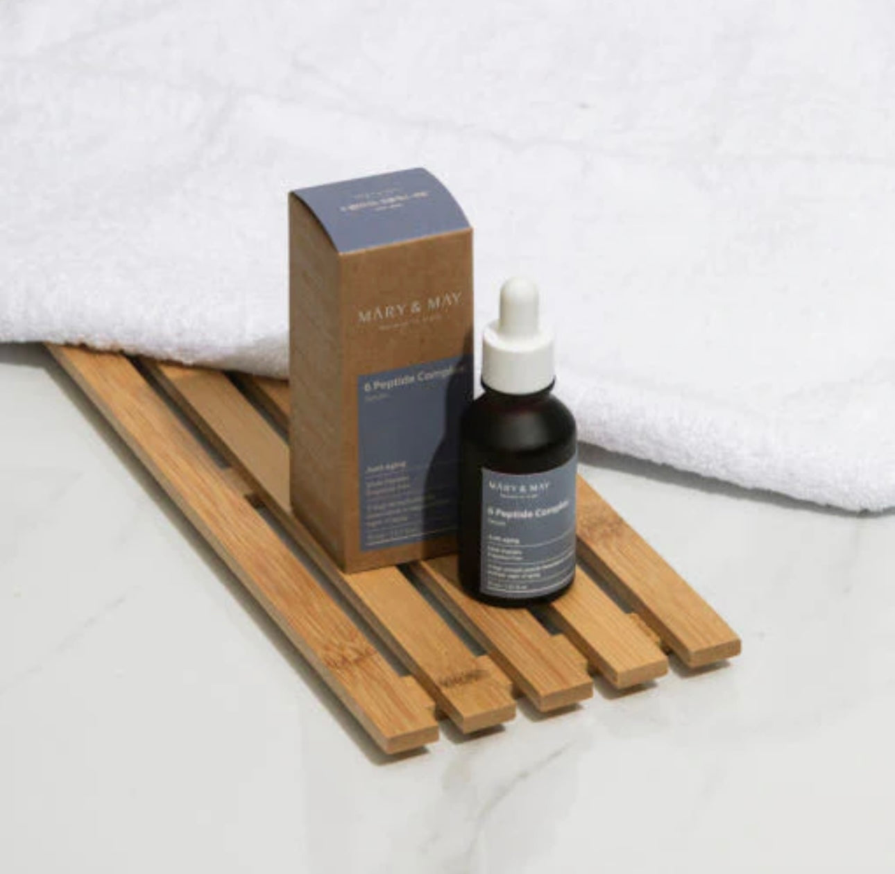 Box of the Mary and May 6 Peptide Serum, featuring clean, minimalist K-beauty packaging.