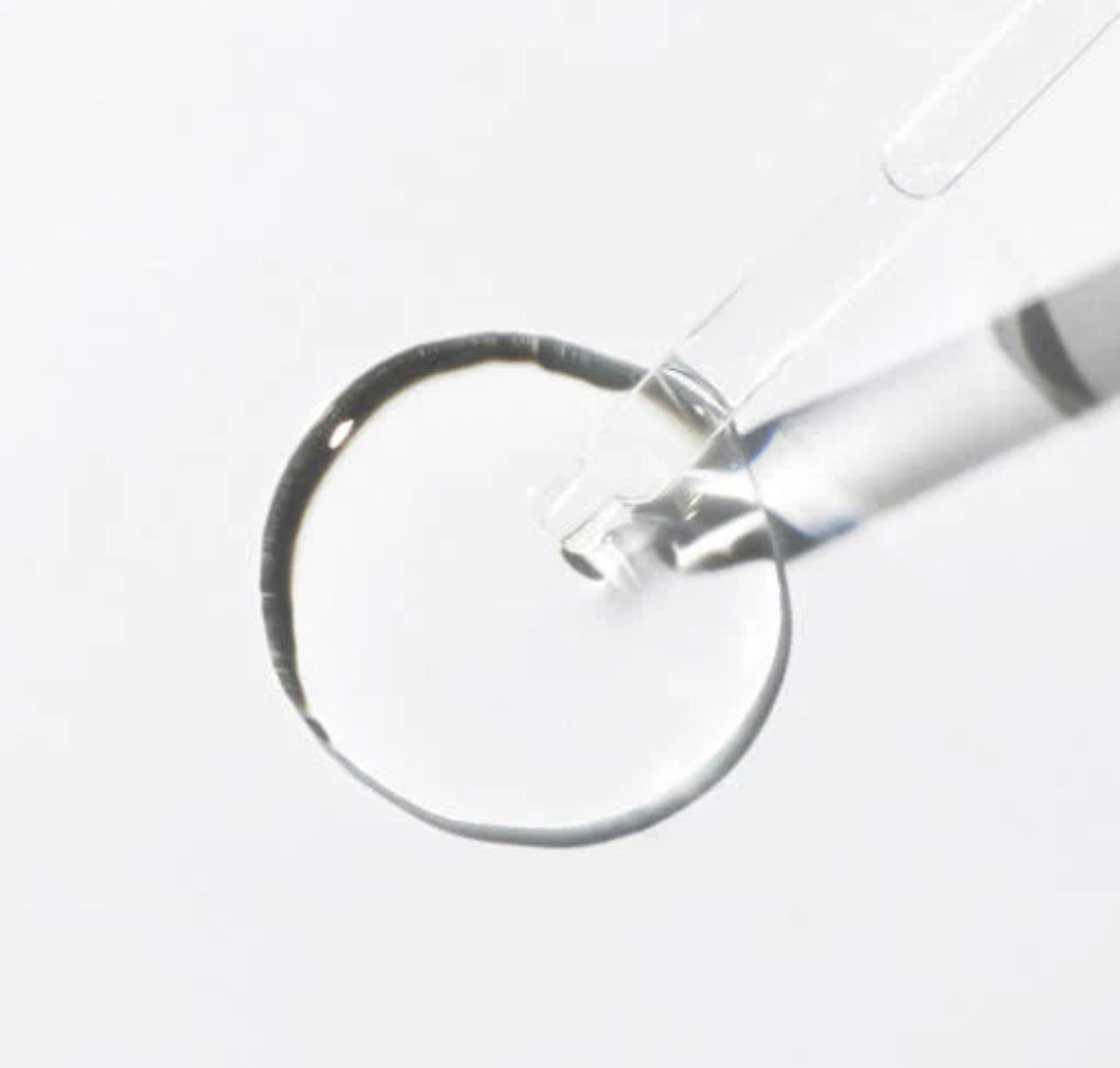 Close-up of the 6 peptide serum's lightweight, easily absorbable texture on the dropper.