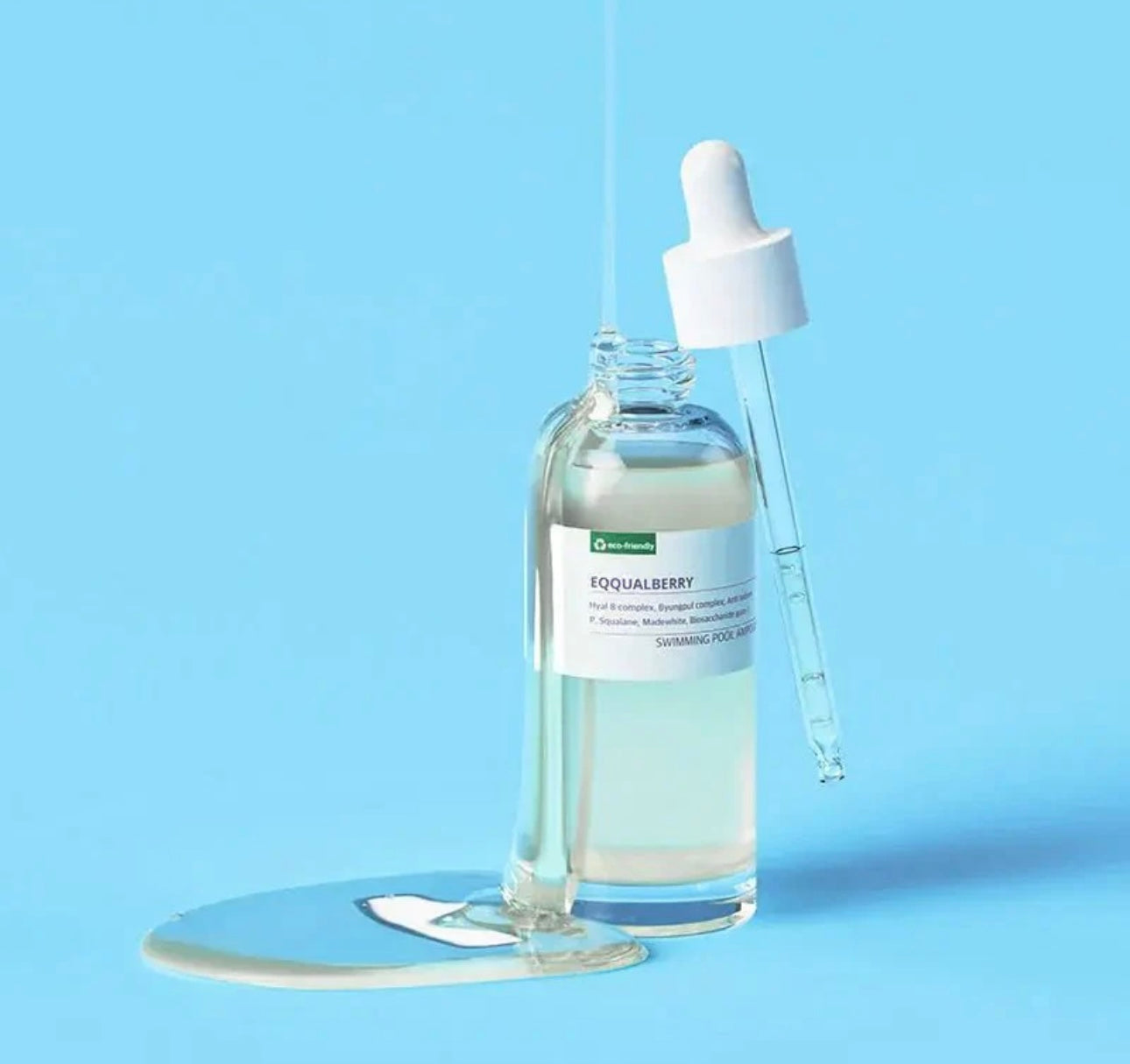 Unboxing the Eqqualberry Pool Ampoule, showing the sleek bottle and packaging.