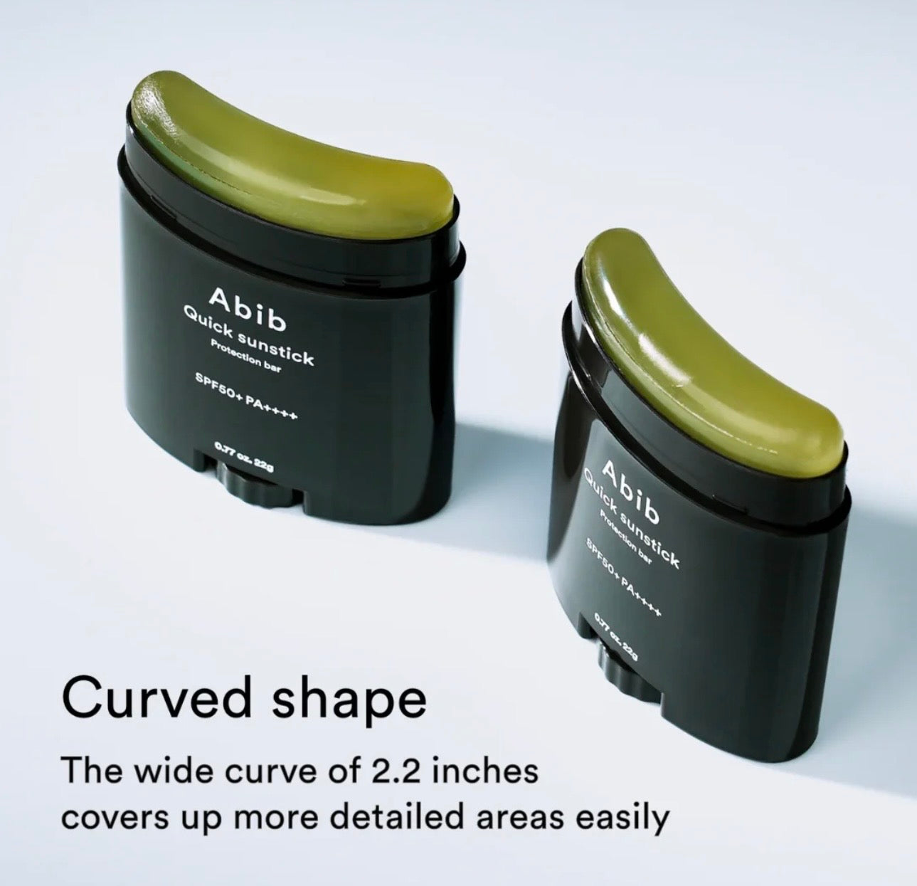 Hand holding Abib Quick Sunstick 22g size showing portable pocket-friendly design.