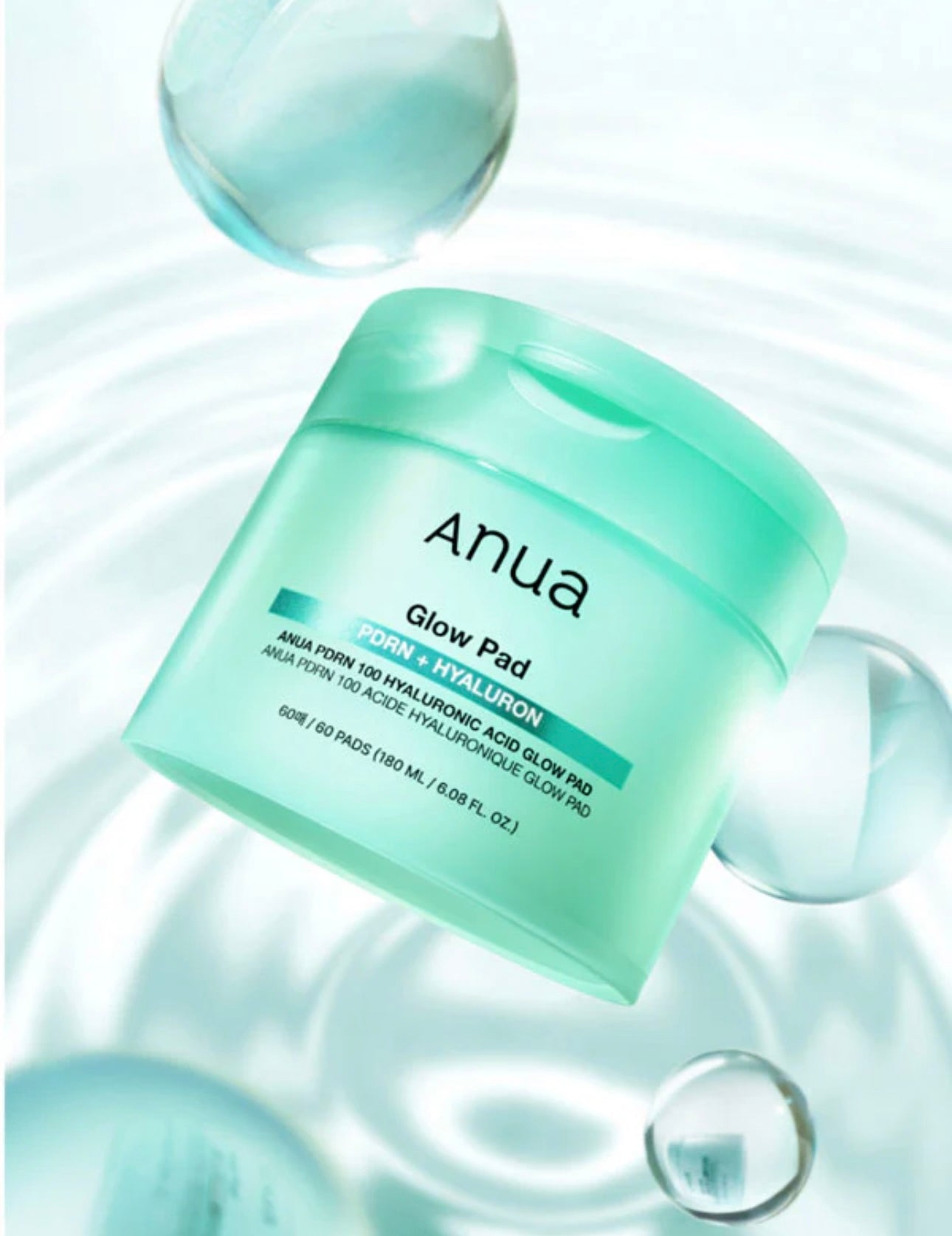 Anua PDRN Hyaluronic Glow Pad 60 pcs jar, showing the dual-texture pads.