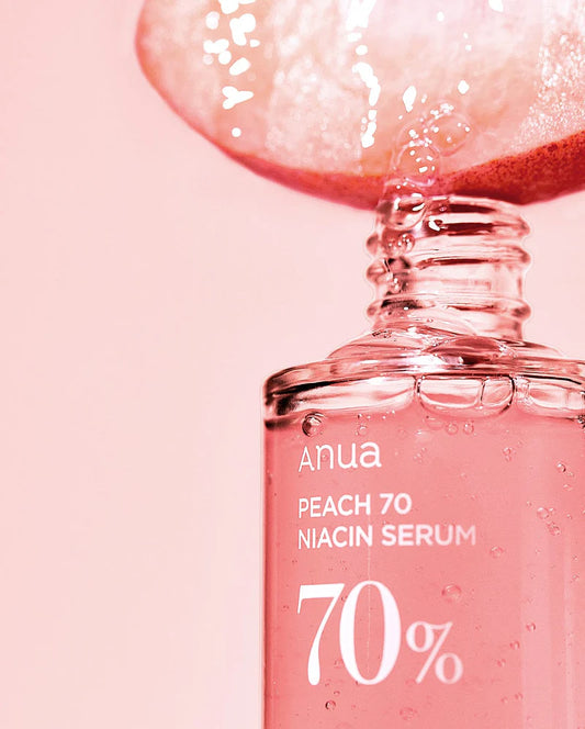 ANUA Peach 70 Niacin Serum 30ml front packaging against a soft background.
