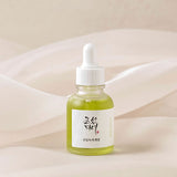 Applying the BOJ green tea serum to calm and hydrate sensitive skin, gently massaging the calming serum.