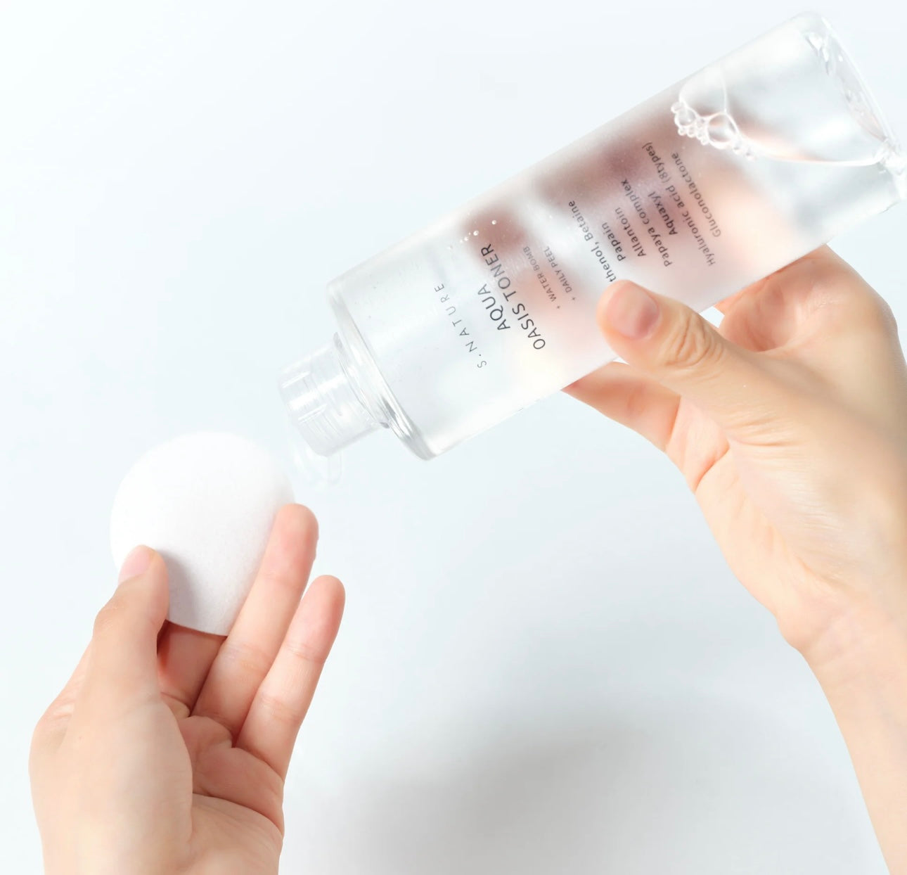 Aqua Oasis hydrating toner bottle angled view, showcasing the clear packaging and product volume.