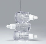 Close up of the Aqua Squalane serum texture dripping from a dropper showing its lightweight and hydrating consistency.