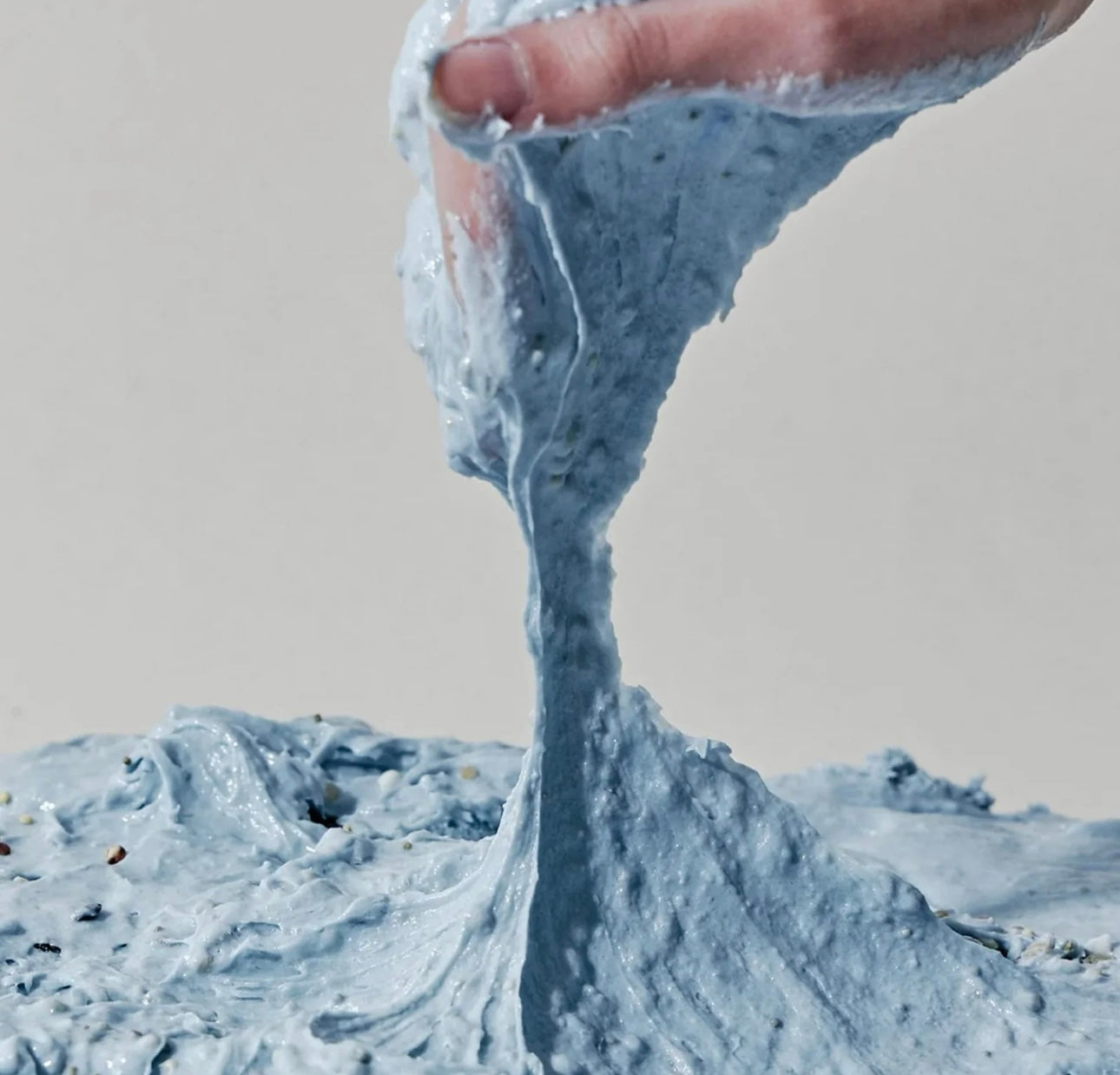 Rich, gentle lather of the Arencia rice mochi cleanser being massaged onto skin.