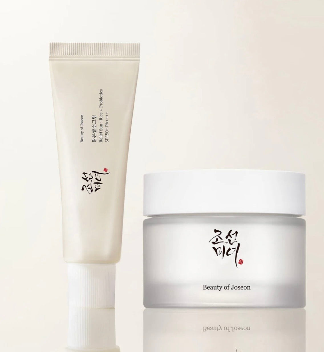 Beauty of Joseon day and night care duo set including Relief Sun sunscreen and Dynasty Cream jar in elegant packaging.