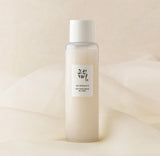 Beauty of Joseon Glow Replenishing Rice Milk in its elegant glass bottle.