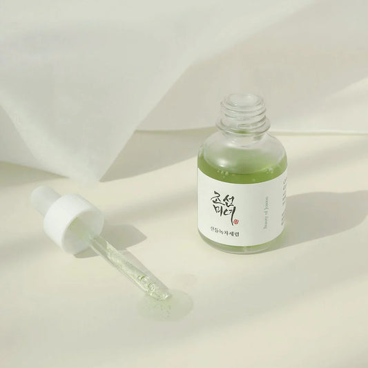 The transparent bottle of the Beauty of Joseon green tea serum, showing the lightweight formula inside.