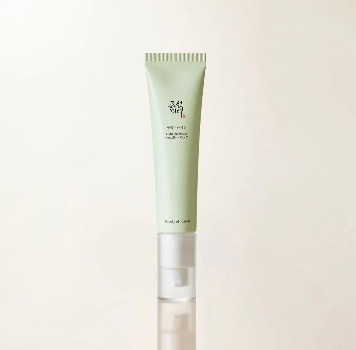 Gently patting the Revive Eye Serum around the eye area.