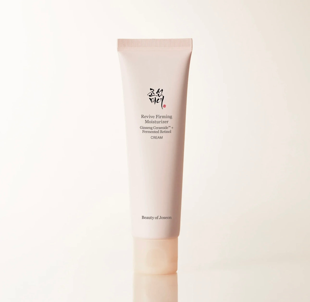 Beauty of Joseon Revive Firming Moisturizer 60ml tube packaging standing upright against a beige background.