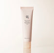 Beauty of Joseon Revive Firming Moisturizer 60ml tube packaging standing upright against a beige background.