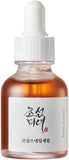 Dropper releasing Revive Serum — ginseng and snail mucin lightweight texture