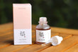 Beauty of Joseon Revive Serum (ginseng + snail mucin) bottle with box on a wooden surface