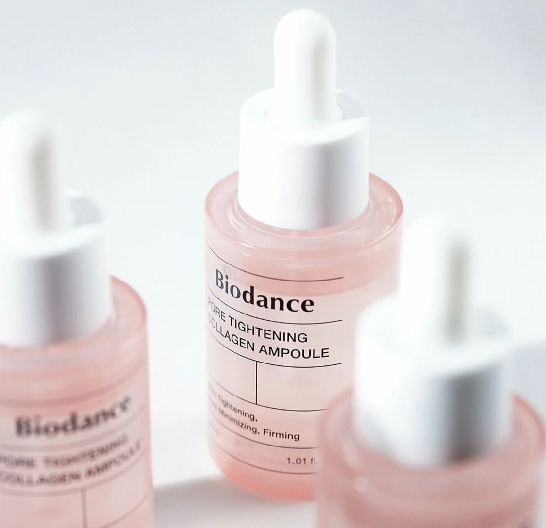 Close-up of dropper releasing serum from the Biodance collagen ampoule showing lightweight texture