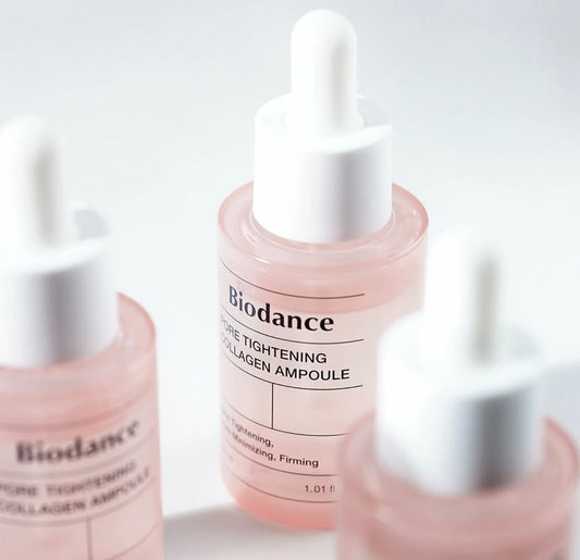 Close-up of dropper releasing serum from the Biodance collagen ampoule showing lightweight texture