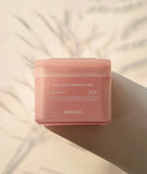 Close up of a Mediheal collagen ampoule pad saturated in hydrating, milky collagen essence.