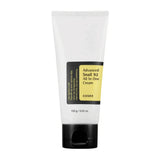 Lifestyle image: COSRX Advanced Snail 92 All-in-One Cream (100g) on bathroom counter — everyday snail mucin moisturizer.