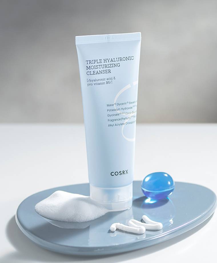 COSRX Hydrium Triple Hyaluronic Moisturizing Cleanser 150ml box and tube packaging on a white background.