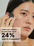 Model applying COSRX Niacinamide 15 serum with dropper — helps reduce redness and soothe skin.