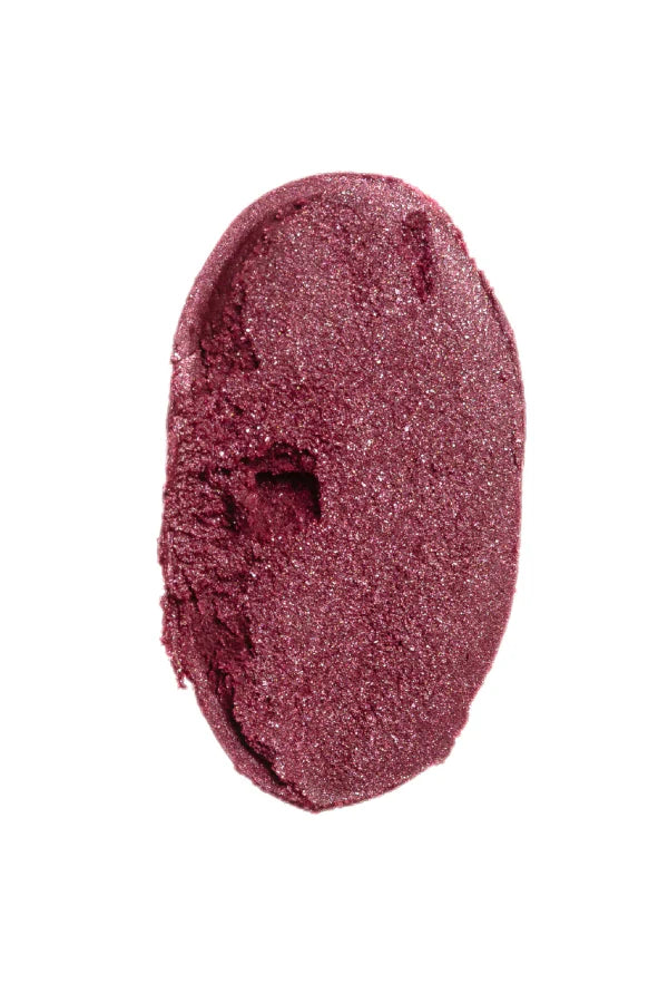 Red glittery makeup swatch on a white background