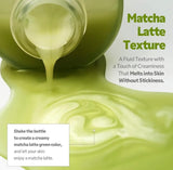 Hand holding the TIRTIR Matcha Dual bottle while shaking to activate the bi-phase serum.