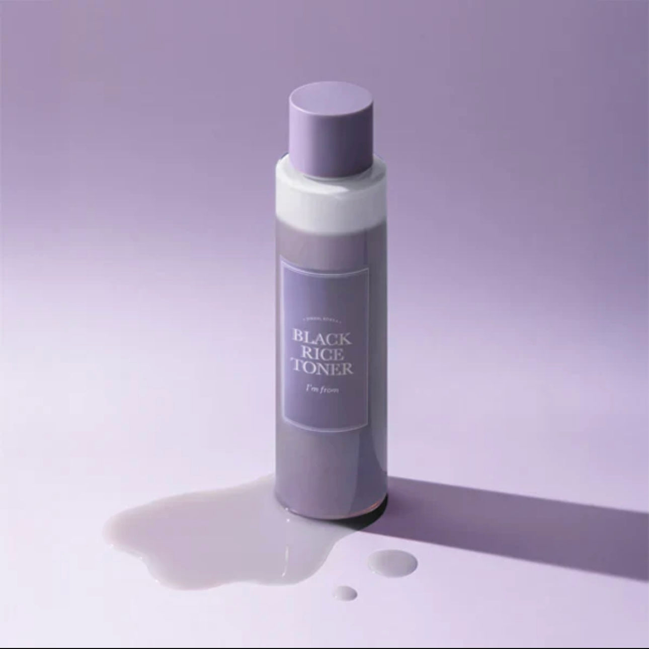 Close-up view showing the dual-layer formula of the Black Rice Toner separating into water and nourishing oil.