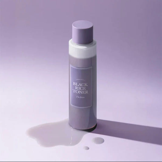 Close-up view showing the dual-layer formula of the Black Rice Toner separating into water and nourishing oil.