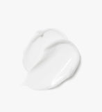 A pearl of i m from rice cream on a spatula, revealing its soft, lightweight gel-cream texture that absorbs quickly.