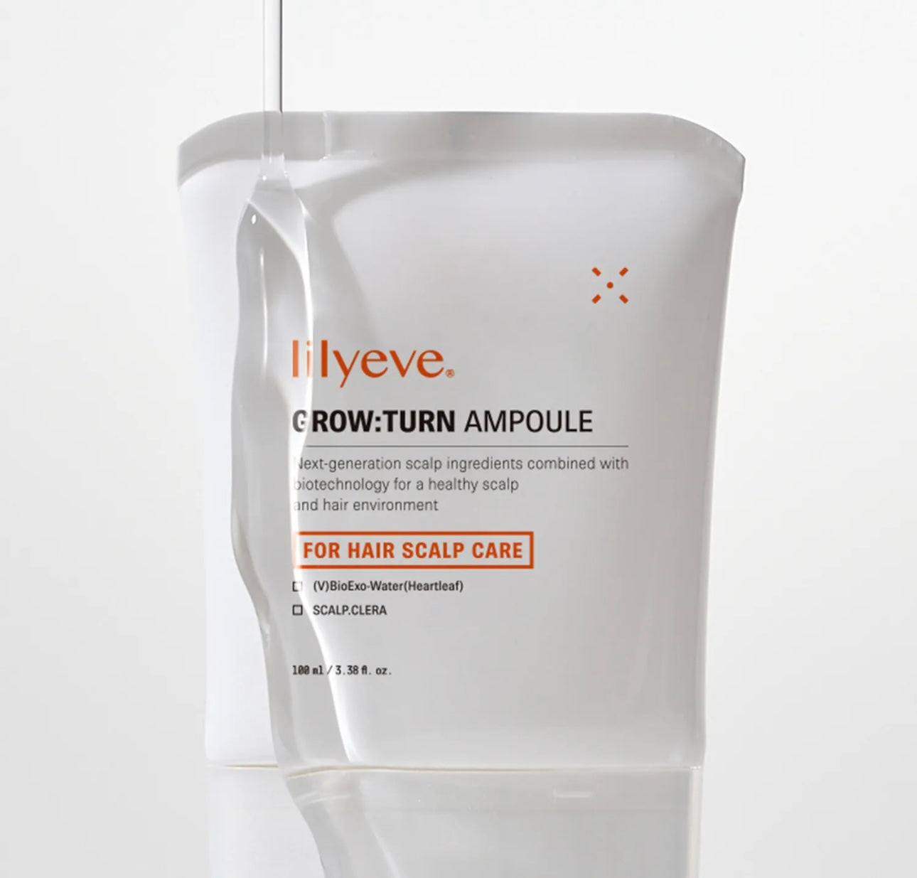 Close-up of the 38-bristle brush applicator on Lilyeve Grow Turn Ampoule for even scalp application