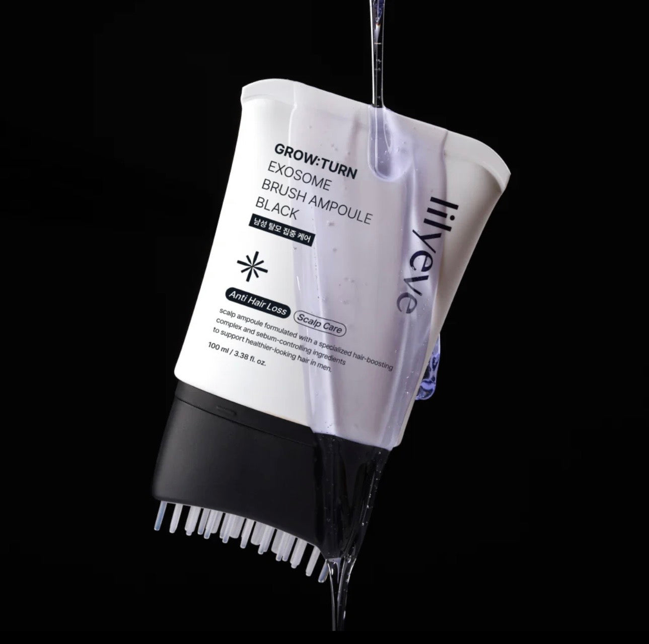 Applying the lilyeve Grow Turn Exosome Brush Ampoule Prime directly to the scalp with the built-in brush.