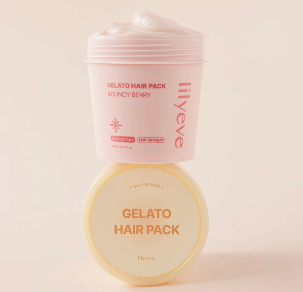 Applying Lilyeve Repair Turn Gelato Hair Pack Bouncy Berry to mid-lengths and ends of damp hair.