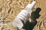 Drops of LILYFIELD Wrinkle Smoothing Serum with Phyto Collagen showing lightweight texture