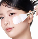 Close-up view of the rich, milky texture of the collagen wrapping mask