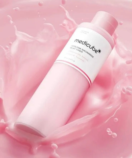 Medicube PDRN pink niacinamide milky toner boxed packaging displayed next to the product bottle.